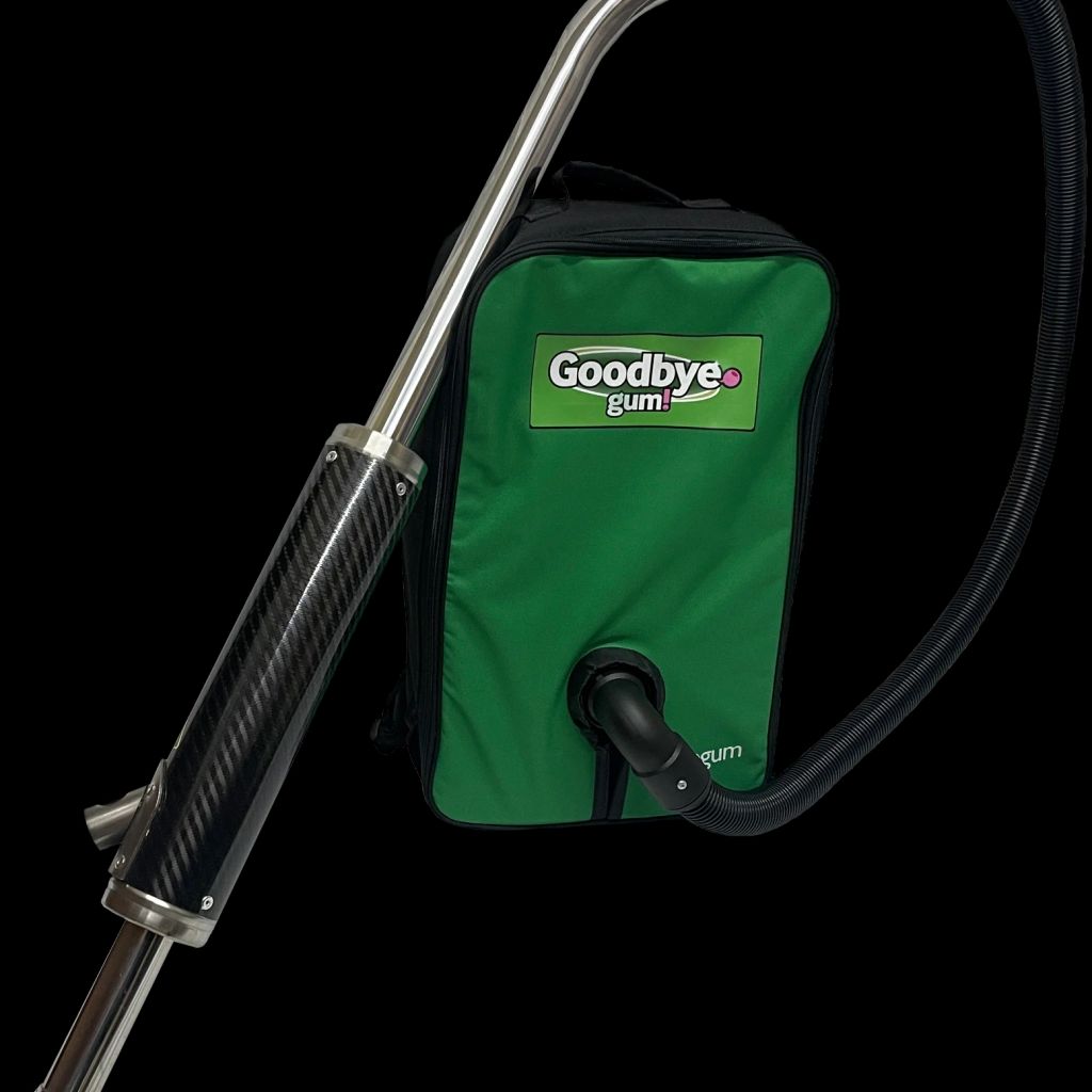 A vacuum device for removing gum, featuring a green bag.