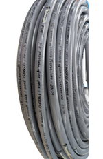 A coiled roll of gray softwash hose or tubing with black printed specifications and text running along the outer surface, shown against a plain white background.