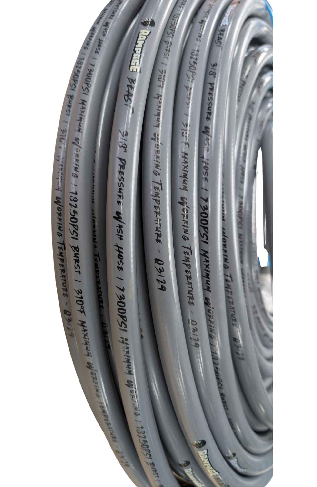 A coiled roll of gray softwash hose or tubing with black printed specifications and text running along the outer surface, shown against a plain white background.