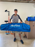 SkyVac Customer holding his pole bag after making a purchase