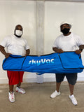 SkyVac customers holding the pole bag